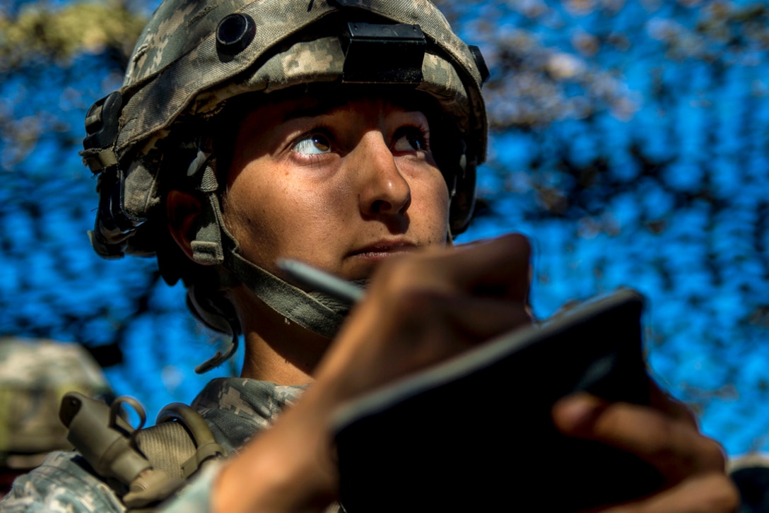 Army Sgt. Jazmyn Medina, a reservist assigned to the 56th Military Police Company, takes notes for a mission during a combat support training exercise at Fort Hunter Liggett, Calif., July 22, 2017. Army Reserve photo by Master Sgt. Michel Sauret