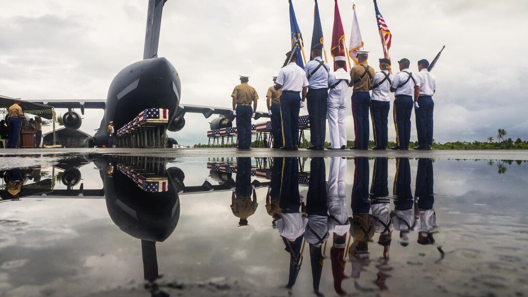 Members of the Defense POW/MIA Accounting Agency conclude a repatriation ceremony in Kiribati, July 25, 2017, for service members missing from the battle of Tarawa. History Flight Inc., an agency strategic partner, evacuated the remains for at least 17 service members. The agency's mission is to provide the fullest possible accounting for U.S. missing personnel to their families and the nation. DoD photo by Bill Dasher