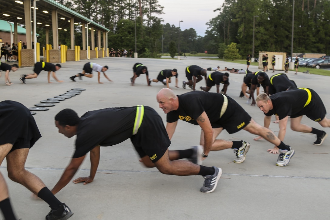 Soldiers participate in a CrossFit exercise during morning physical readiness training at Fort Stewart, Ga., July 21, 2017. Soldiers did bear crawls, running and crabwalks before the CrossFit circuit workout competition. Army photo by Spc. Elizabeth White