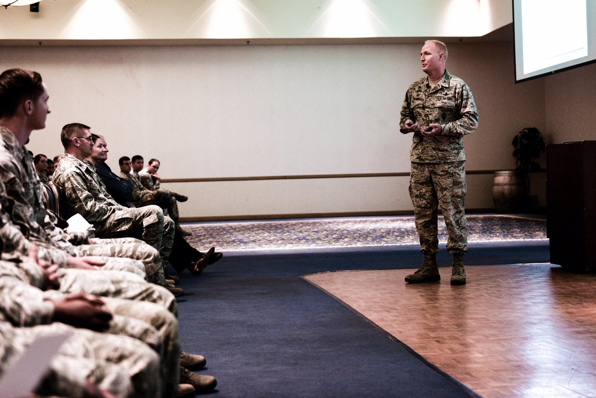 Col. Michael Hough, 30th Space Wing commander, speaks to Airmen during an All Call, July 25, 2017, Vandenberg Air Force Base, Calif. Accompanied by Chief Master Sgt. Diena Mosely, 30th SW command chief, the duo used their first official All Call to formally introduce themselves and their priorities to the wing. (U.S. Air Force photo by Senior Airman Ian Dudley/Released)