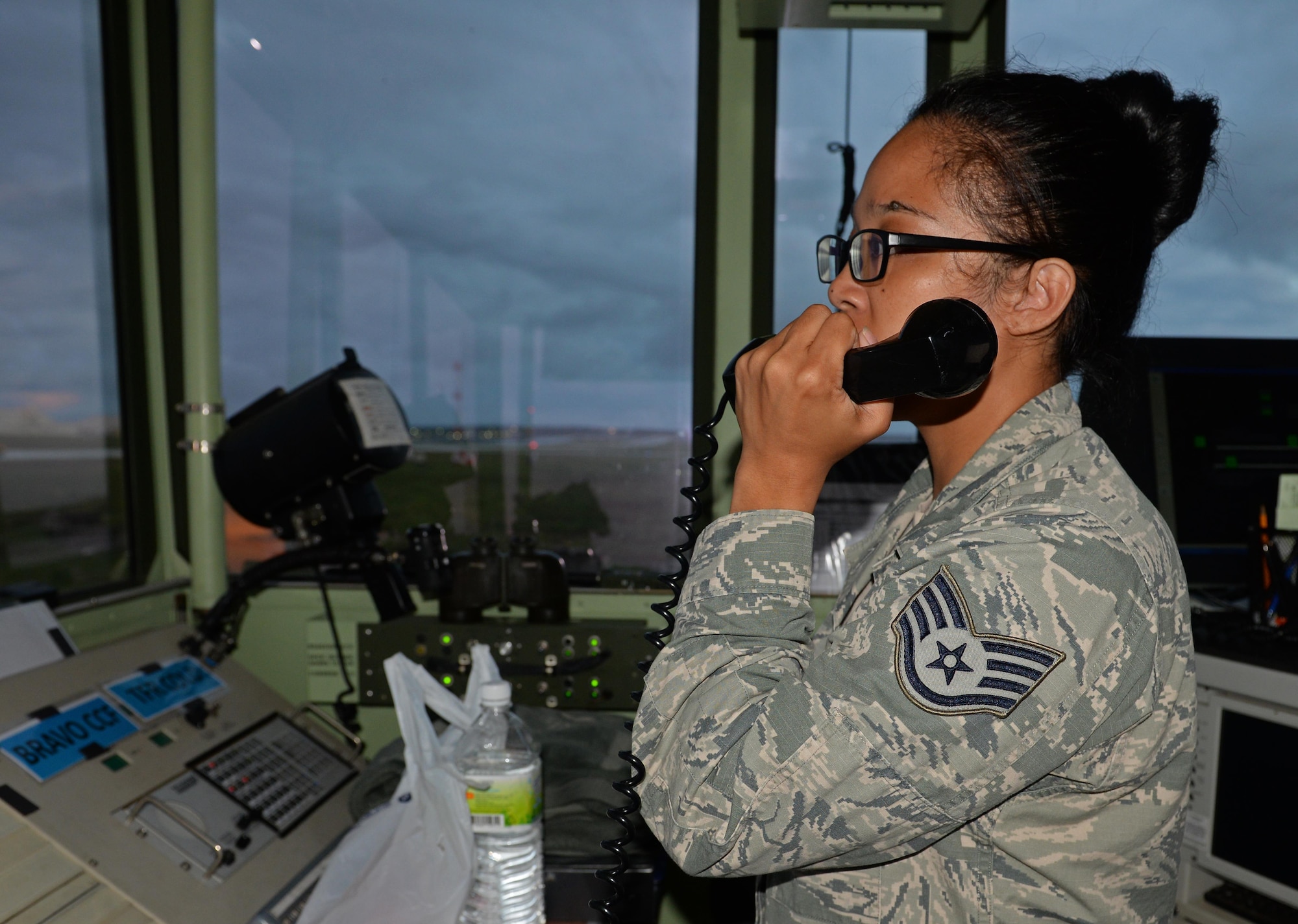U.S. Air Force Staff Sgt. Tiffany Degracia, 36th Operation Support Squadron air traffic controller communicates via radio with pilots preparing to take off June 20, 2017, at Andersen Air Force Base, Guam. Air traffic control Airmen assigned to the 36th Operation Support Squadron began work in the new tower cab here June 30 after spending almost three months working in the mobile tower unit on the flightline. (U.S. Air Force photo by Senior Airman Alexa Ann Henderson)
