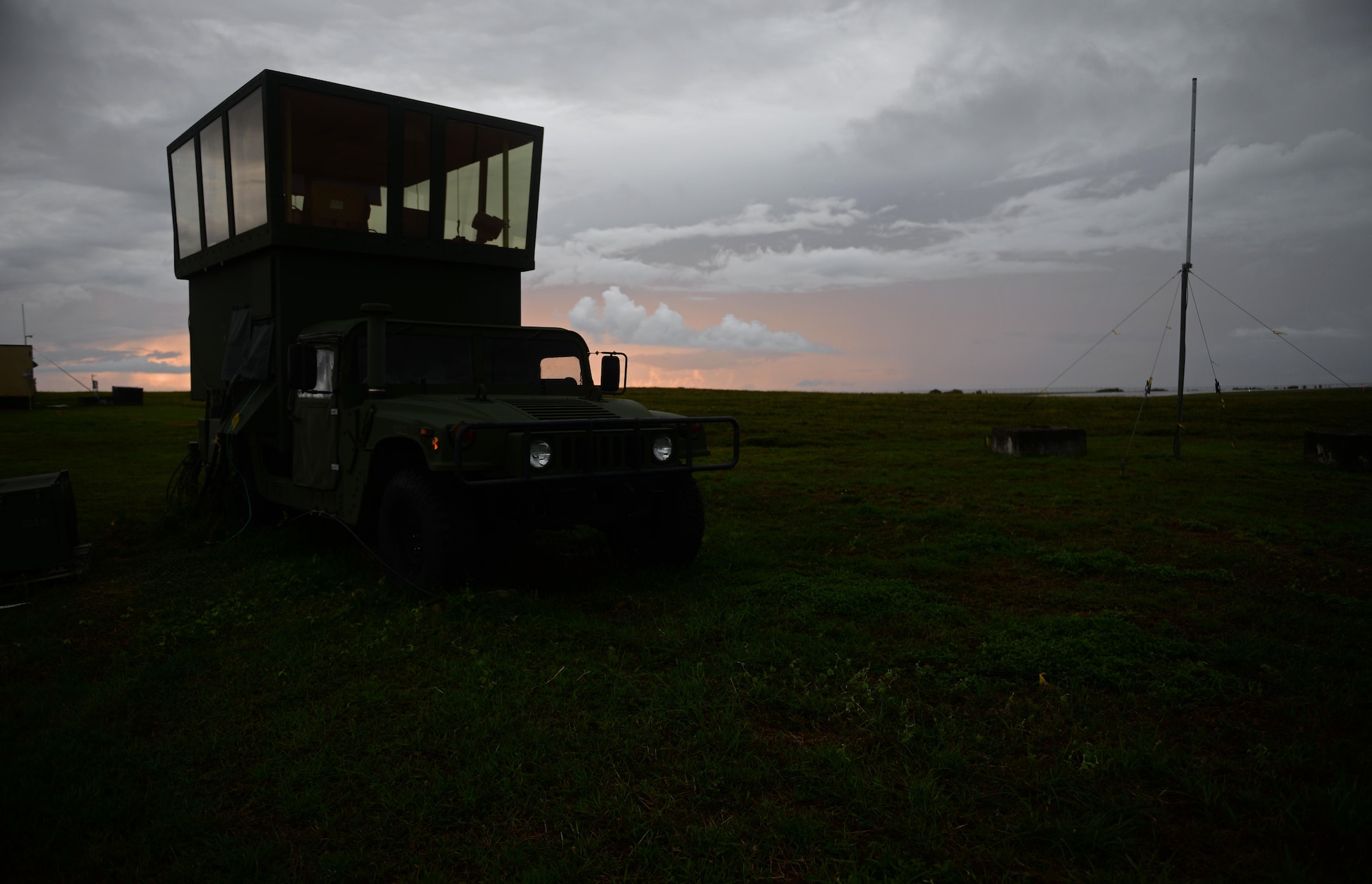 The sun rises behind an MSN-7 mobile control tower parked on the flightline June 20, 2017, at Andersen Air Force Base, Guam. Air traffic control Airmen assigned to the 36th Operation Support Squadron began work in the new tower cab here June 30 after spending almost three months working in the mobile tower unit on the flightline. (U.S. Air Force photo by Senior Airman Alexa Ann Henderson) 
