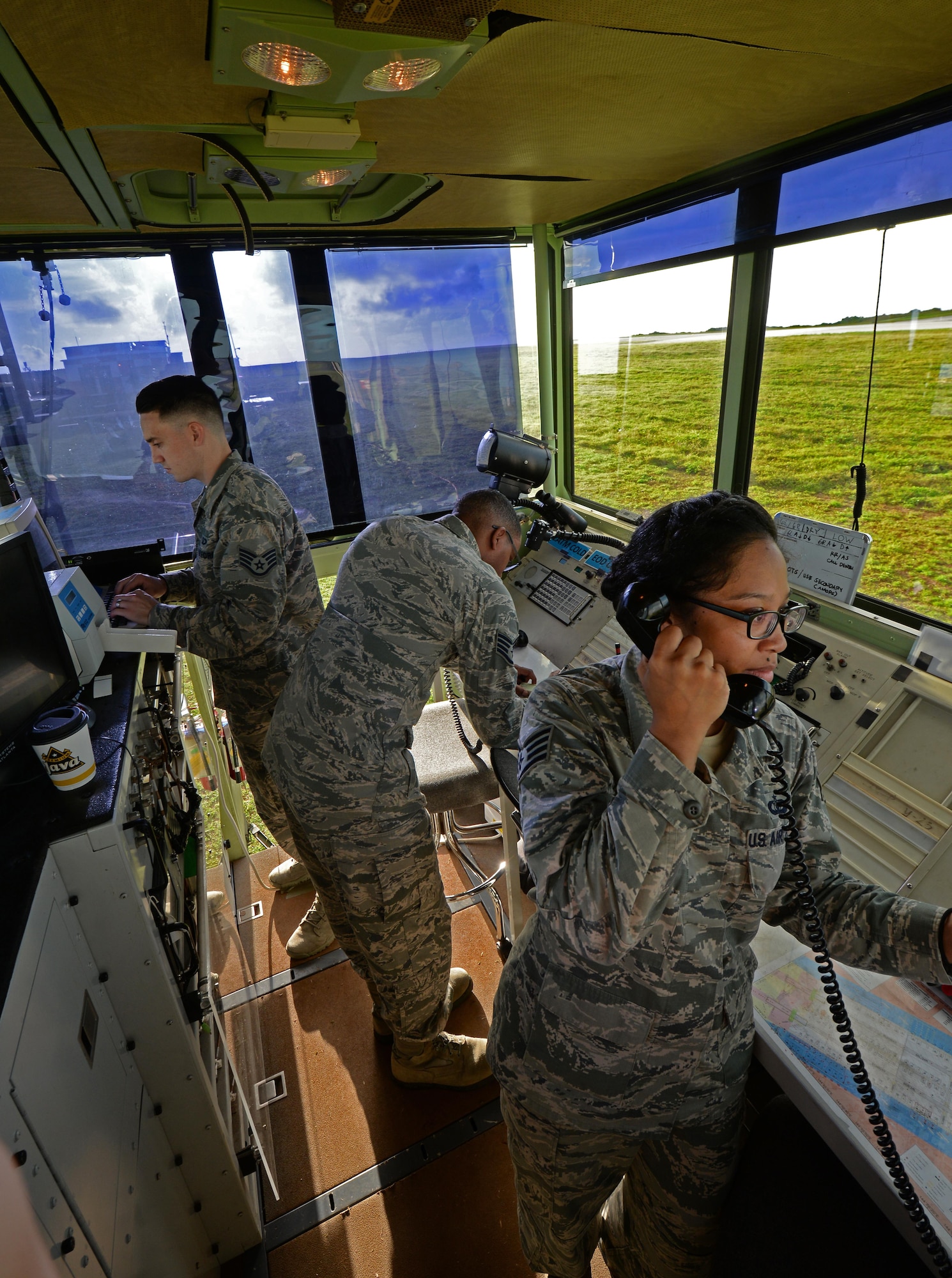 U.S. Air Force Airmen assigned to the 36th Operation Support Squadron work in the MSN-7 mobile tower unit parked on the flightline June 22, 2017, at Andersen Air Force Base, Guam. Air traffic control Airmen assigned to the 36th Operation Support Squadron began work in the new tower cab here June 30 after spending almost three months working in the mobile tower unit on the flightline. (U.S. Air Force photo by Senior Airman Alexa Ann Henderson)
