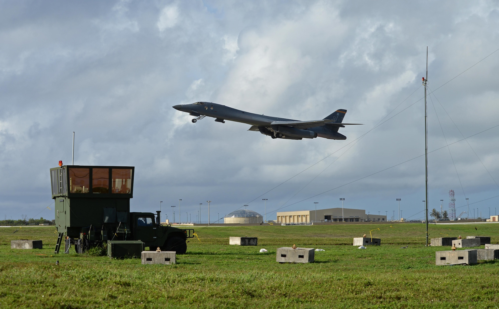 A B-1B Lancer takes off next to an MSN-7 mobile tower unit parked on the flightline June 22, 2017, at Andersen Air Force Base, Guam. Air traffic control Airmen assigned to the 36th Operation Support Squadron began work in the new tower cab here June 30 after spending almost three months working in the mobile tower unit on the flightline. (U.S. Air Force photo by Senior Airman Alexa Ann Henderson) 