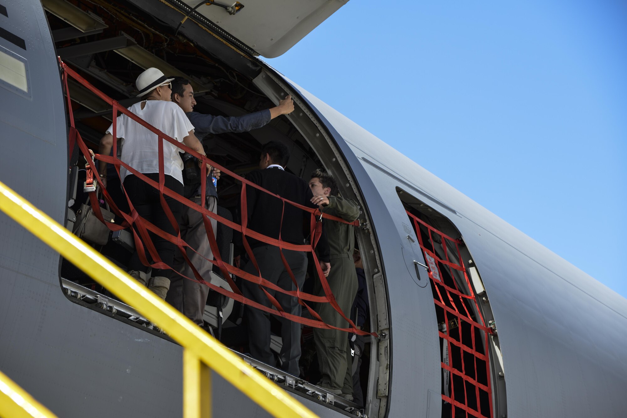 Guests tour a KC-10 Extender from Travis Air Force Base, Calif., during Feria Aeronautica Internacional—Colombia 2017 in Rionegro, Colombia, July 14, 2017. The United States Air Force is participating in the four-day air show with two South Carolina Air National Guard F-16s as static displays, plus static displays of a KC-135, KC-10, along with an F-16 aerial demonstration by the Air Combat Command’s Viper East Demo Team. United States military participation in the air show provides an opportunity to strengthen our military-to-military relationships with regional partners and provides the opportunity to meet with our Colombian air force counterparts and facilitate interoperability, which can be exercised in future cooperation events such as exercises and training. (Courtesy Photo)