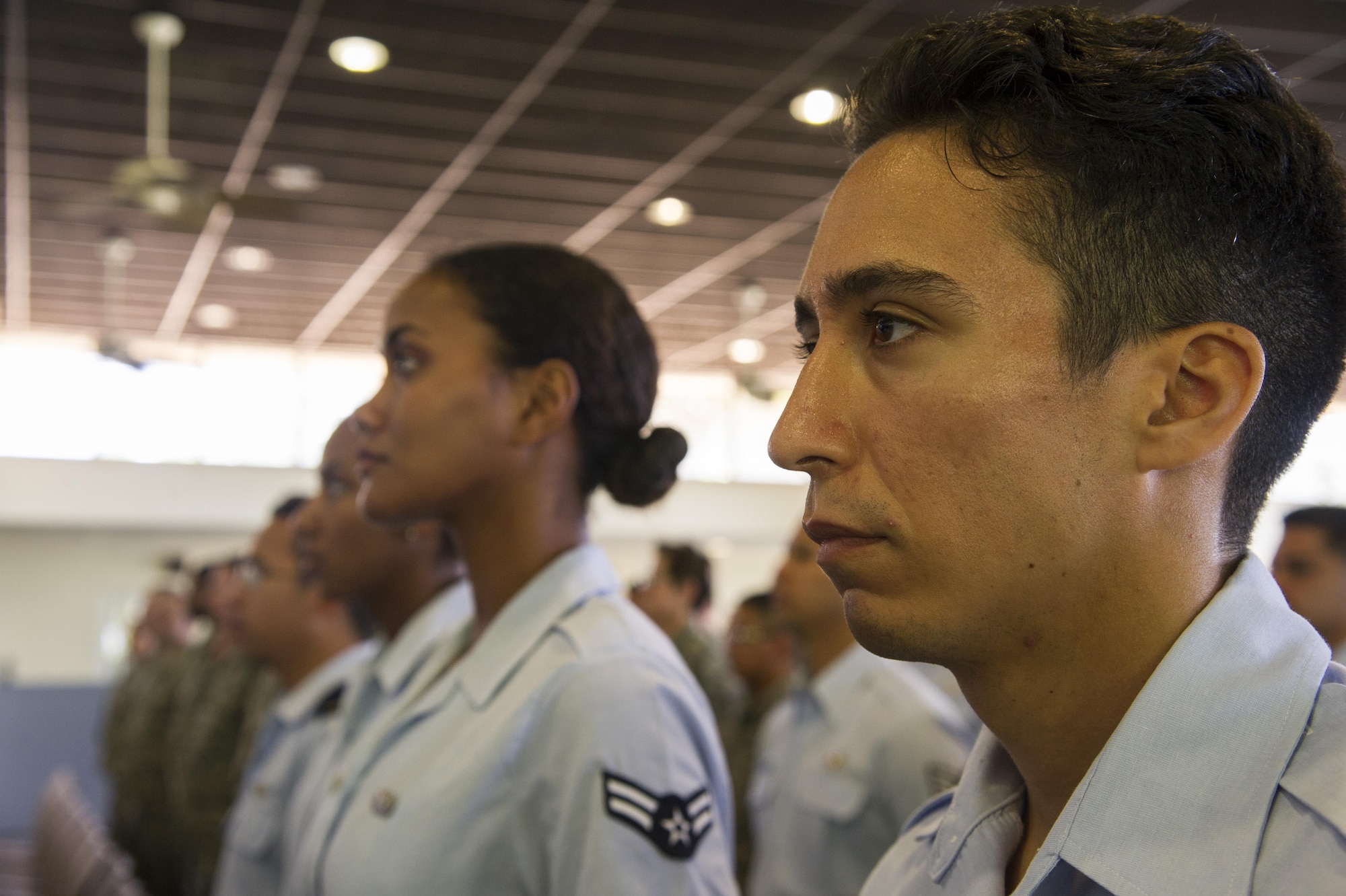 Personnel assigned to the 692nd Intelligence, Surveillance and Reconnaissance Group (692 ISRG) and family members stand for the National Anthem and the Hawaii Pono'i during the 692 ISRG Change of Command Ceremony, Joint Base Pearl Harbor-Hickam, Hawaii, July 17, 2017. The 692 ISRG, headquartered at Joint Base Pearl Harbor-Hickam, Hawaii, processes, exploits and disseminates ISR data collected by U-2, Predator and Global Hawk aircraft.  (U.S. photo by Tech. Sgt. Heather Redman)