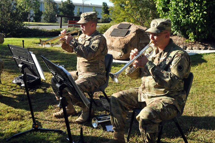 Sgt. 1st Class Todd Borges, music performance team leader, and Sgt. Mark Koehl, an army musician, both of America’s First Corps Army Band play at a memorial service in Enoggera, Australia during Talisman Saber 17, July 17, 2017. The memorial service took place at Memorial Walk, which is considered a living memorial as a tree is planted to represent Australian soldiers that were killed in combat. (U.S. Army photo by Sgt. Debrah Sanders, 366th Mobile Public Affairs Detachment)