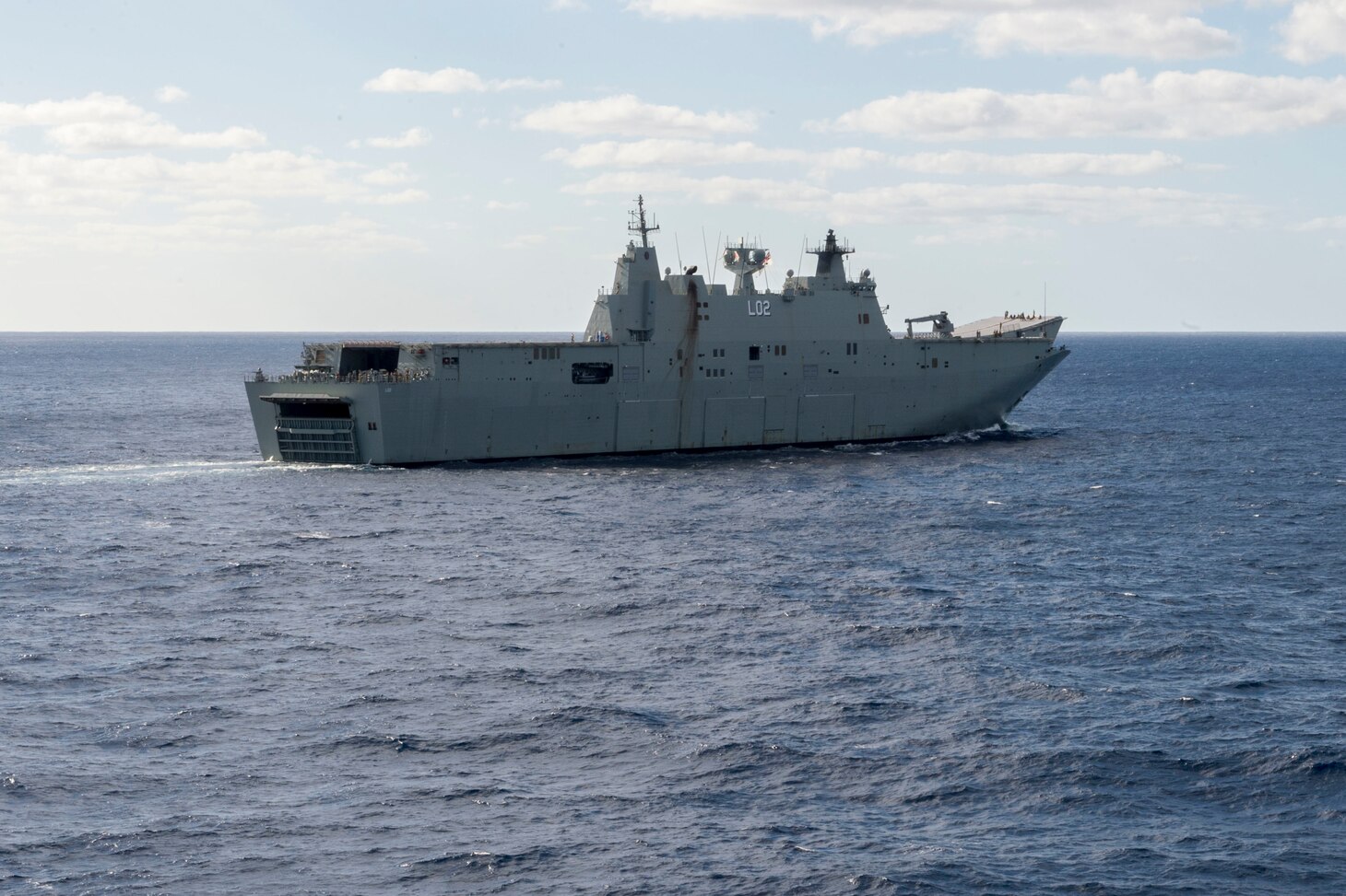 170722-N-ZL062-003 CORAL SEA (July 22, 2017) The Royal Australian Navy amphibious assault ship HMAS Canberra (III) (L02) steams in a 19-ship formation with U.S.-Australian-New Zealand ships at the conclusion of Talisman Saber 17. Talisman Saber is a biennial U.S.-Australia bilateral exercise held off the coast of Australia meant to achieve interoperability and strengthen the U.S.-Australia alliance. (U.S. Navy photo by Mass Communication Specialist 3rd Class Sarah Myers/Released)