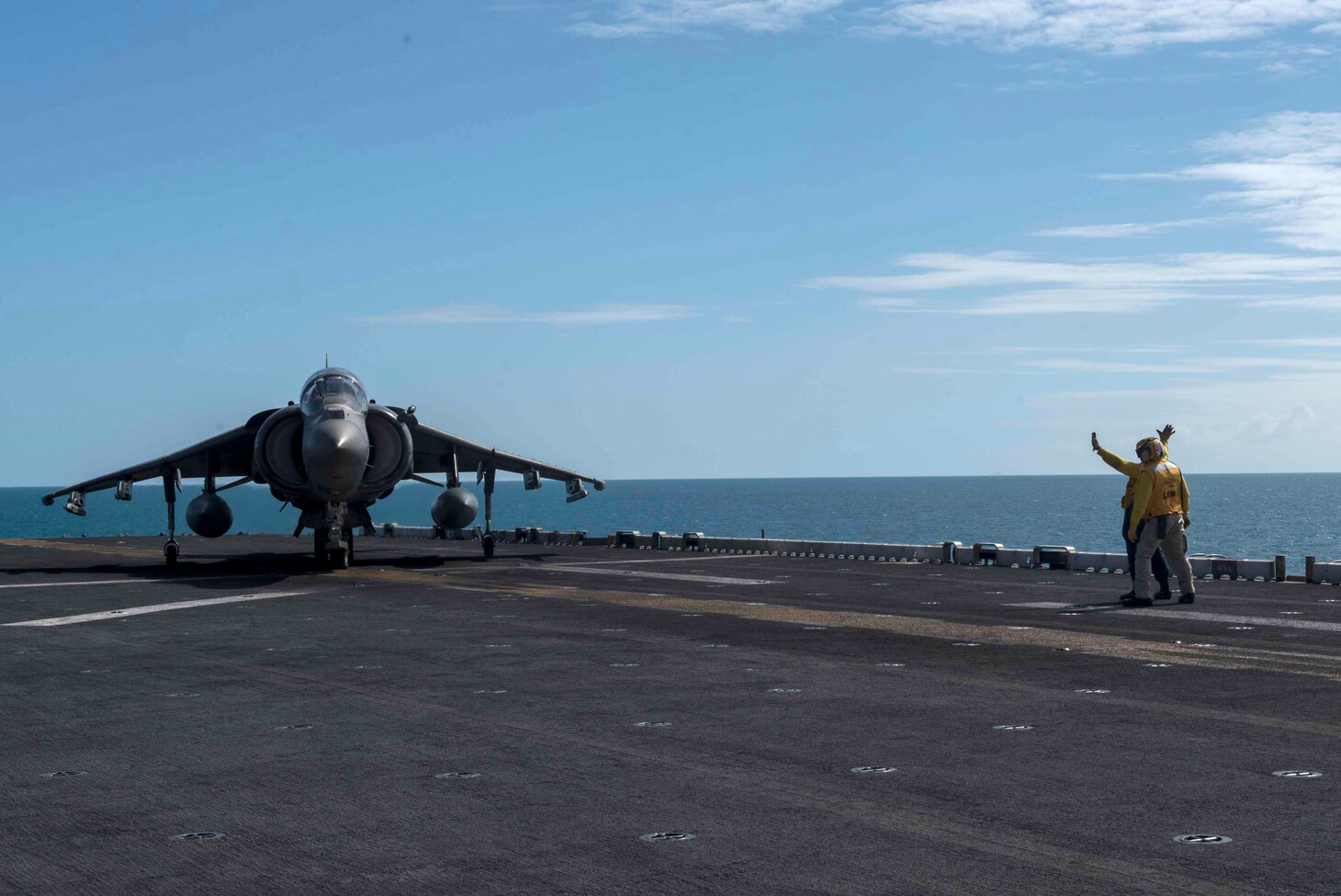 170723-N-NB544-423 CORAL SEA (July 23, 2017) Aviation Boatswain's Mate (Handling) 3rd Class Tiffanie Allenderriley, from Joplin, Mo., directs an AV-8B Harrier pilot, assigned to the "Tomcats" of Marine Attack Squadron (VMA) 311, 31st Marine Expeditionary Unit (MEU), on the flight deck of the amphibious assault ship USS Bonhomme Richard (LHD 6) during Talisman Saber 17. Talisman Saber is a biennial U.S.-Australian bilateral exercise held off the coast of Australia meant to achieve interoperability and strengthen the U.S.-Australian alliance. (U.S. Navy photo by Mass Communication Specialist 2nd Class Kyle Carlstrom/Released)