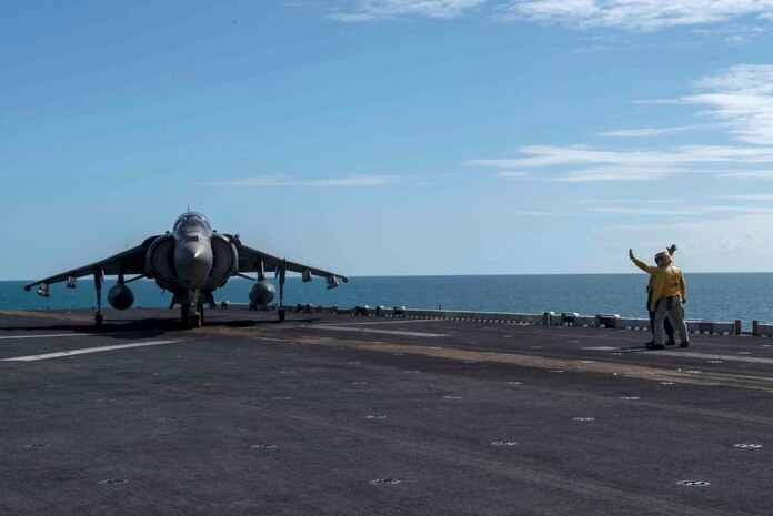 170723-N-NB544-423 CORAL SEA (July 23, 2017) Aviation Boatswain's Mate (Handling) 3rd Class Tiffanie Allenderriley, from Joplin, Mo., directs an AV-8B Harrier pilot, assigned to the "Tomcats" of Marine Attack Squadron (VMA) 311, 31st Marine Expeditionary Unit (MEU), on the flight deck of the amphibious assault ship USS Bonhomme Richard (LHD 6) during Talisman Saber 17. Talisman Saber is a biennial U.S.-Australian bilateral exercise held off the coast of Australia meant to achieve interoperability and strengthen the U.S.-Australian alliance. (U.S. Navy photo by Mass Communication Specialist 2nd Class Kyle Carlstrom/Released)