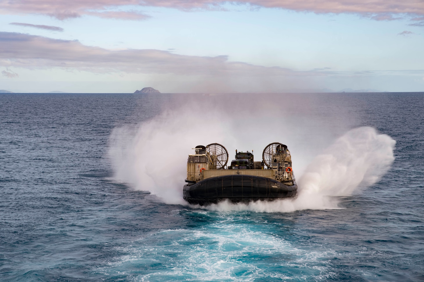 170723-N-XK809-232 CORAL SEA (July 23, 2017) Landing craft air cushion (LCAC) 9, assigned to Naval Beach Unit (NBU) 7, approaches the well deck of the amphibious assault ship USS Bonhomme Richard (LHD 6) as Marines of the 31st Marine Expeditionary Unit (MEU) return from training with the Australia Army in the Shoalwater Bay Training Area as part of Talisman Saber 17. Talisman Saber is a biennial U.S.-Australian bilateral exercise held off the coast of Australia meant to achieve interoperability and strengthen the U.S.-Australian alliance. (U.S. Navy photo by Mass Communication Specialist 3rd Class William Sykes/Released)