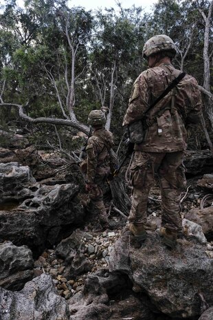 Paratroopers of 4th Infantry Brigade Combat Team, 25th Infantry Division check a rocky area for opposing forces or koala bears during Exercise Talisman Saber in Shoalwater Bay Training Area, Australia July 14. (U.S. Army Photo by Staff Sgt. Daniel Love)