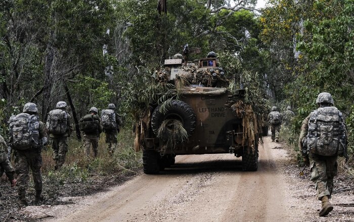 6th Brigade Engineer Battalion, 4th Infantry Brigade Combat Team, 25th Infantry Division paratroopers move alongside an Australian Army Protected Mobility Vehicle during Exercise Talisman Saber in Shoalwater Bay Training Area, Australia July 14. (U.S. Army Photo by Staff Sgt. Daniel Love)