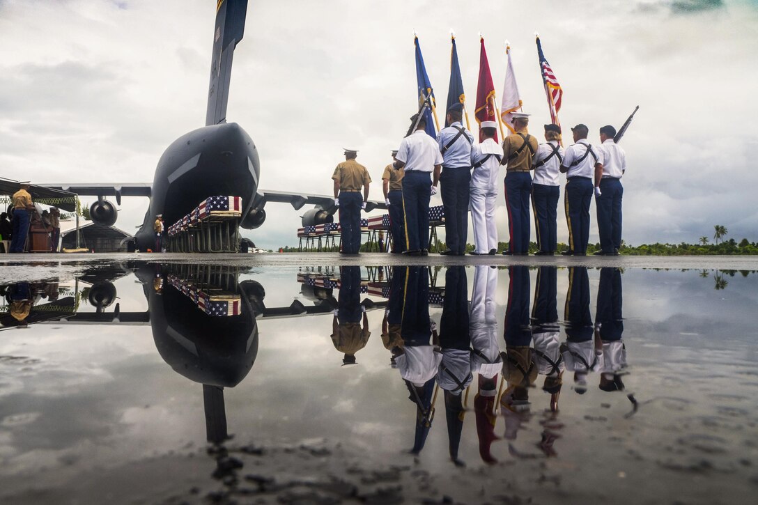 Members of the Defense POW/MIA Accounting Agency conclude a repatriation ceremony in Kiribati, July 25, 2017, for service members missing from the battle of Tarawa. History Flight Inc., an agency strategic partner, evacuated the remains for at least 17 service members. The agency's mission is to provide the fullest possible accounting for U.S. missing personnel to their families and the nation. DoD photo by Bill Dasher