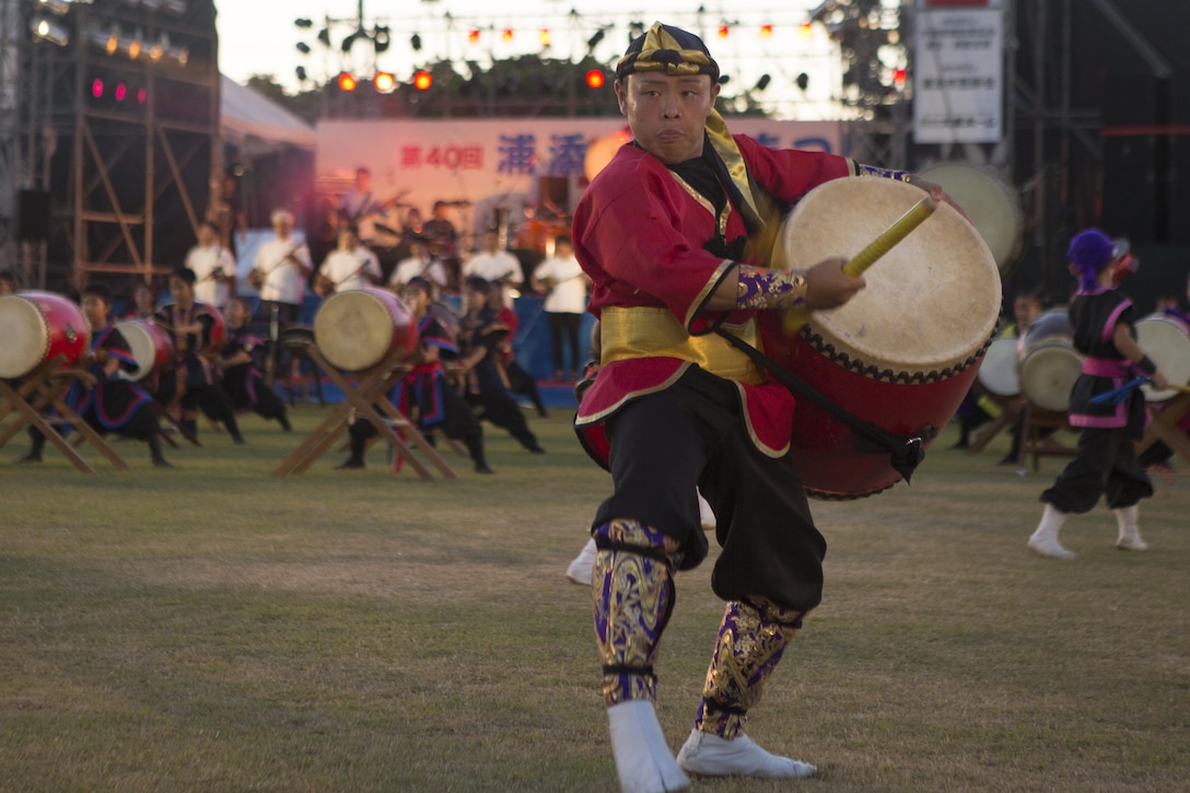 A young man performs the traditional Eisa dance during “The Picture Scrolls of the Three Great Urasoe Kings” in the 40th Annual Tedako Matsuri Festival July 22 in Urasoe City, Okinawa, Japan. The Eisa dance is a form of folk dance originating in Okinawa. During this festival, respects are paid to King Eiso, a powerful king of the Ryukyu Kingdom.