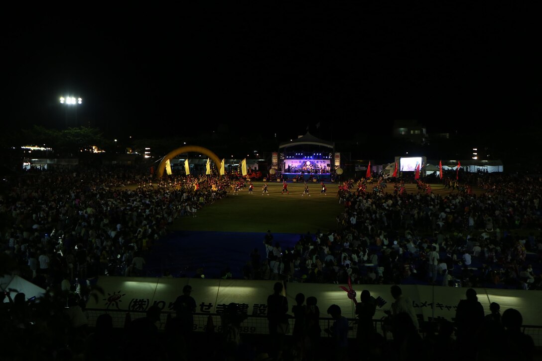 Hundreds of people gather to watch the performance “The Picture Scrolls of the Three Great Urasoe Kings” during the 40th Annual Tedako Matsuri Festival July 22 in Urasoe City, Okinawa, Japan. This festival is a way for the community to pay respects to King Eiso, a powerful king of the Ryukyu Kingdom. The festival featured many food venders, games, haunted houses, bounce houses and live music.