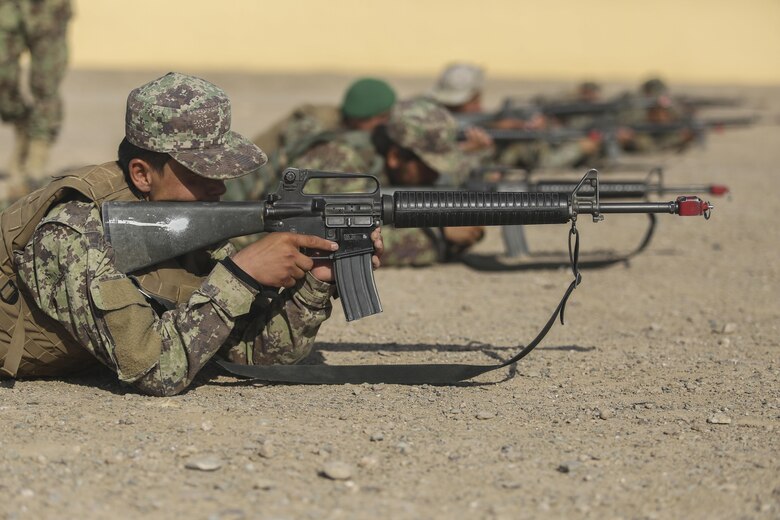 Afghan National Army soldiers with 2nd Kandak, 4th Brigade, 215th Corps conduct a simulated squad attack at Camp Shorabak, Afghanistan, June 19, 2017. The unit completed an eight-week operational readiness cycle at the Helmand Province Regional Military Training Center July 24 with assistance from U.S. Marine advisors assigned to Task Force Southwest. Throughout the course, approximately 600 soldiers learned infantry tactics and weapons techniques in order to enhance their warfighting capabilities. (U.S. Marine Corps photo by Sgt. Lucas Hopkins)
