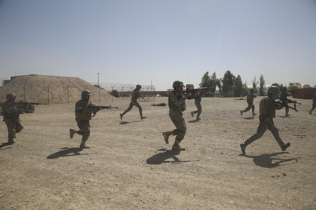 Afghan National Army soldiers with 2nd Kandak, 4th Brigade, 215th Corps run toward a simulated enemy compound at Camp Shorabak, Afghanistan, July 2, 2017. Hundreds of soldiers with the unit graduated from an operational readiness cycle July 24, an eight-week training regimen designed to enhance the students’ warfighting capabilities. U.S. Marine advisors assigned to Task Force Southwest assisted ANA instructors throughout the course, using their experience to develop the soldiers into highly-trained infantrymen. (U.S. Marine Corps photo by Sgt. Lucas Hopkins)