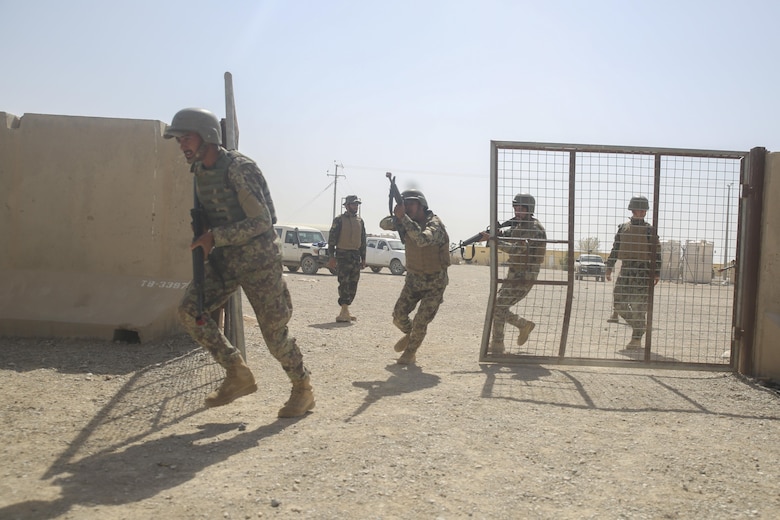 Afghan National Army soldiers with 3nd Kandak, 4th Brigade, 215th Corps prepare to clear a room during military operations in urban terrain training at Camp Shorabak, Afghanistan, July 5, 2017. Approximately 15 Marine advisors assisted their Afghan counterparts throughout an operational readiness cycle, an eight-week training program teaching soldiers infantry skills and weapons techniques in order to thwart enemy presence in Helmand Province. (U.S. Marine Corps photo by Sgt. Lucas Hopkins)