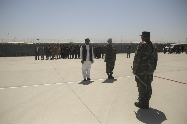 Hayatullah Hayat, center-left, the governor of Helmand Province, and Afghan National Army Brig. Gen. Wali Mohammed Ahmadzai, center-right, the commanding general of 215th Corps, greet ANA Col. Shahwali Zazai, right, the commanding officer of the Helmand Regional Military Training Center, during a graduation ceremony at Camp Shorabak, Afghanistan, July 24, 2017. Soldiers with 2nd Kandak, 4th Brigade, 215th Corps completed an operational readiness cycle at the RMTC with assistance from U.S. Marine advisors with Task Force Southwest. The eight-week training program developed the soldiers’ infantry skills and enhanced their lethality in preparation for future combat operations. (U.S. Marine Corps photo by Sgt. Lucas Hopkins)