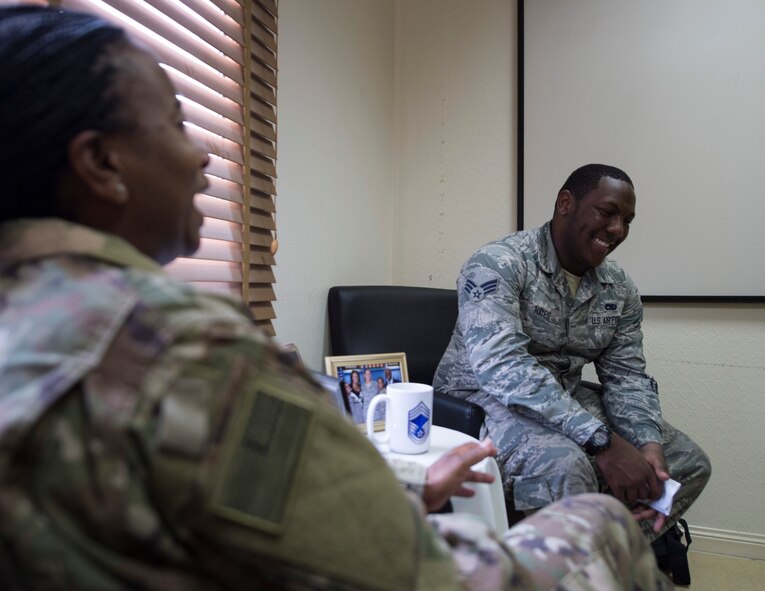U.S. Air Force Senior Airman Quae Hayes, right, an analyst with the 379th Expeditionary Maintenance Group, ask questions of Chief Master Sgt. Gloria Weatherspoon, a chief enlisted manager with the 379th Expeditionary Forces Support Squadron at Al Udeid Air Base, Qatar, July 14, 2017.  Hayes is taking part in a Chief Shadowing Program and was paired up with Chief Master Sgt. Gloria Weatherspoon, right, a chief enlisted manager with the 379th EFSS, for the day in order to receive a glimpse into the day-to-day actives of a Chief Master Sgt. in the U.S. Air Force. (U.S. Air Force photo by Tech. Sgt. Amy M. Lovgren)