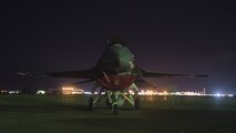 U.S. Air Force Senior Airmen Brandon Rains, a 35th Security Forces Squadron base defense operations controller, roams around an F-16 Fighting Falcon during a night shift at Chitose Air Base, Japan, July 23, 2017. Due to being isolated on a foreign runway, U.S. personnel must have eyesight on the Pacific Air Forces’ F-16 Demonstration Team F-16 Fight Falcons at all times. If anything were to occur, 35th SFS personnel would work with Japan Air Self-Defense Force base operations and security personnel to ensure proper safety measures were completed. (U.S. Air Force Staff Sgt. Deana Heitzman)