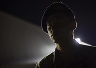 U.S. Air Force Senior Airmen Brandon Rains, a 35th Security Forces Squadron base defense operations controller, stands guard during a night shift at Chitose Air Base, Japan, July 23, 2017. Due to being isolated on a foreign runway, U.S. personnel must have eyesight on the Pacific Air Forces’ F-16 Demonstration Team F-16 Fight Falcons at all times. If anything were to occur, 35th SFS personnel would work with Japan Air Self-Defense Force base operations and security personnel to ensure proper safety measures were completed. (U.S. Air Force Staff Sgt. Deana Heitzman)