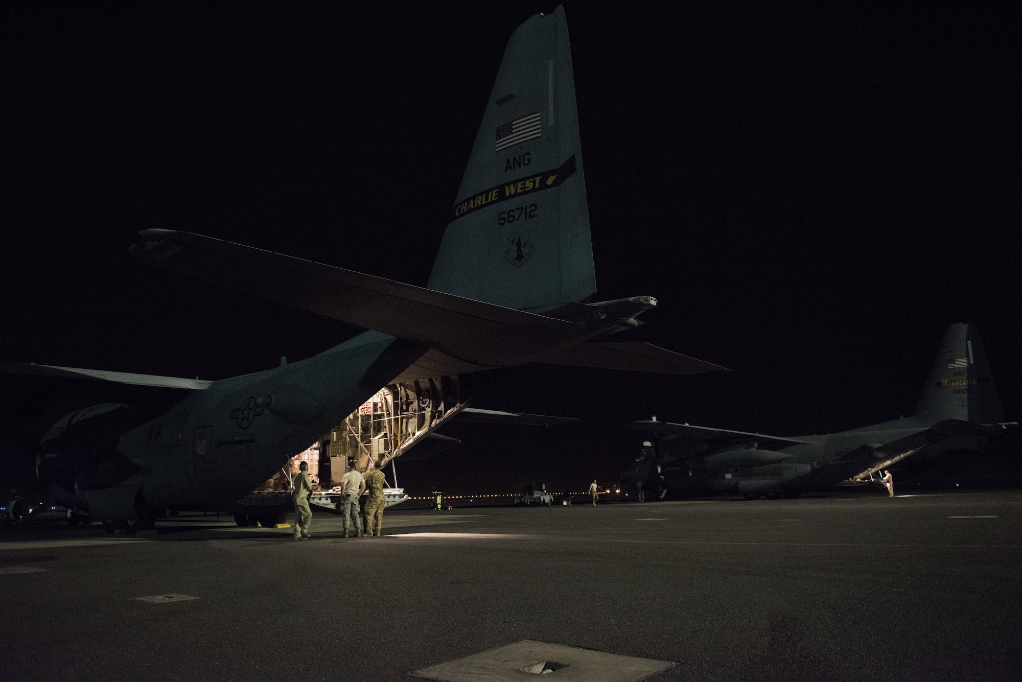 C-130H Hercules aircraft deployed from the 130th Airlift Wing of Charleston, West Virginia and the 133rd Airlift Wing of St. Paul, Minnesota sit on the flightline prior to departing on a combat mission at an undisclosed location in Southwest Asia, July 14, 2017. Air National Guardsmen and their aircraft, deployed in support of Combined Joint Task Force – Operation Inherent Resolve, execute daily airlift missions out of one of the busiest air bases in the U.S. Air Forces Central Command area of responsibility. (U.S. Air Force photo by Tech. Sgt.  Jonathan Hehnly)