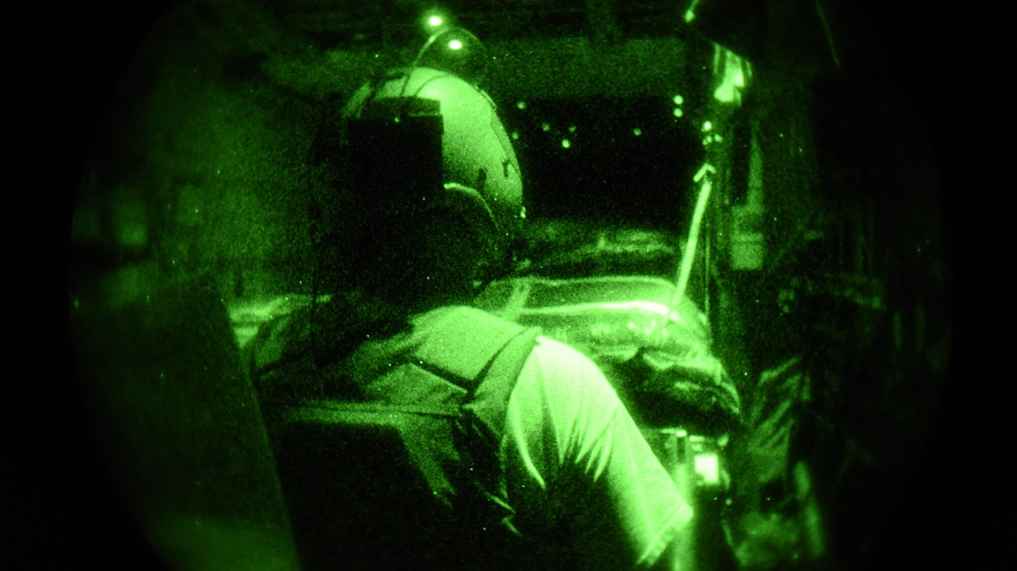 Senior Airman Zachery Carden, a loadmaster with the 737th Expeditionary Airlift Squadron, waits for the cargo door of a C-130 to open in preparation for an air drop, at an undisclosed location in Southwest Asia, July 14, 2017. Air National Guardsmen and their aircraft, deployed in support of Combined Joint Task Force – Operation Inherent Resolve, execute daily airlift missions out of one of the busiest air bases in the U.S. Air Forces Central Command area of responsibility. (U.S. Air Force photo by Tech. Sgt.  Jonathan Hehnly)