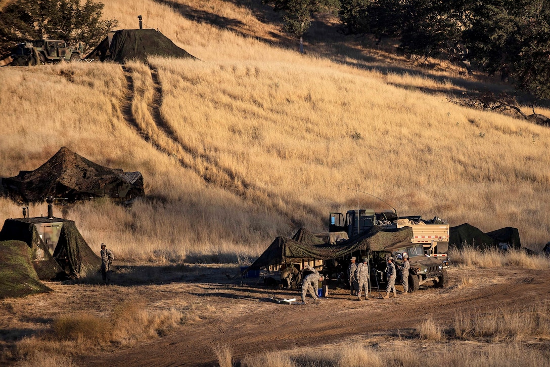 Soldiers prepare their gear before participating in a combat training exercise at Fort Hunter Liggett, Calif., July 22, 2017. The soldiers are reservists assigned to the 56th Military Police Company and the 382nd Military Police Battalion. Army Reserve photo by Master Sgt. Michel Sauret