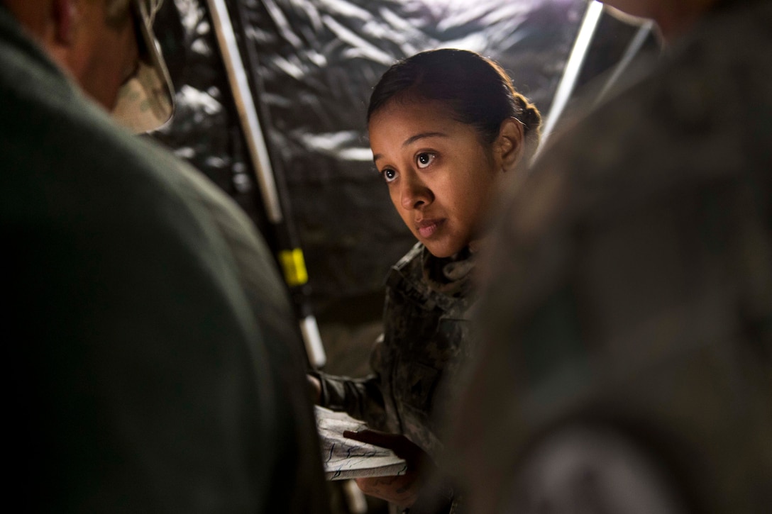 Army Cpl. Vanessa Lebold takes notes during a morning mission brief before participating in a combat training exercise at Fort Hunter Liggett, Calif., July 22, 2017. Lebold is a reservist assigned to the 56th Military Police Company. Army Reserve photo by Master Sgt. Michel Sauret