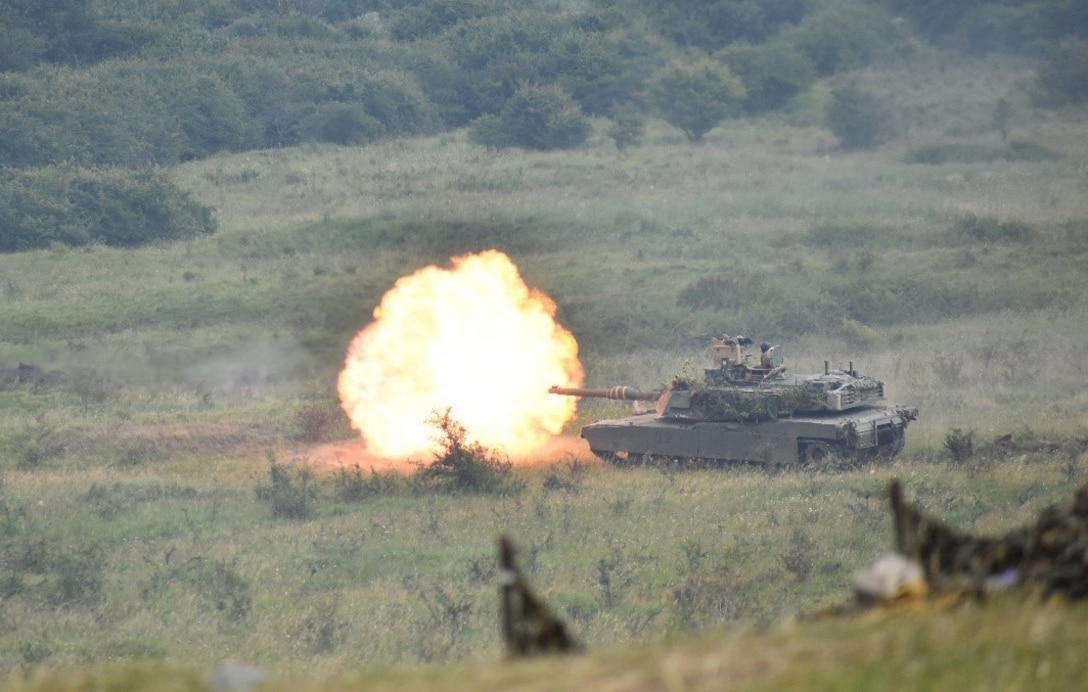 An M1A1 Abrams fires on targets as part of Getica Saber 2017 at the Joint National Training Center, Cincu, Romania. DLA-provided materials such as stones, concrete and lumber were used for projects to improve the JNTC during Resolute Castle 2017, an exercise to strengthen NATO forces’ capability to train and respond to threats within the region.