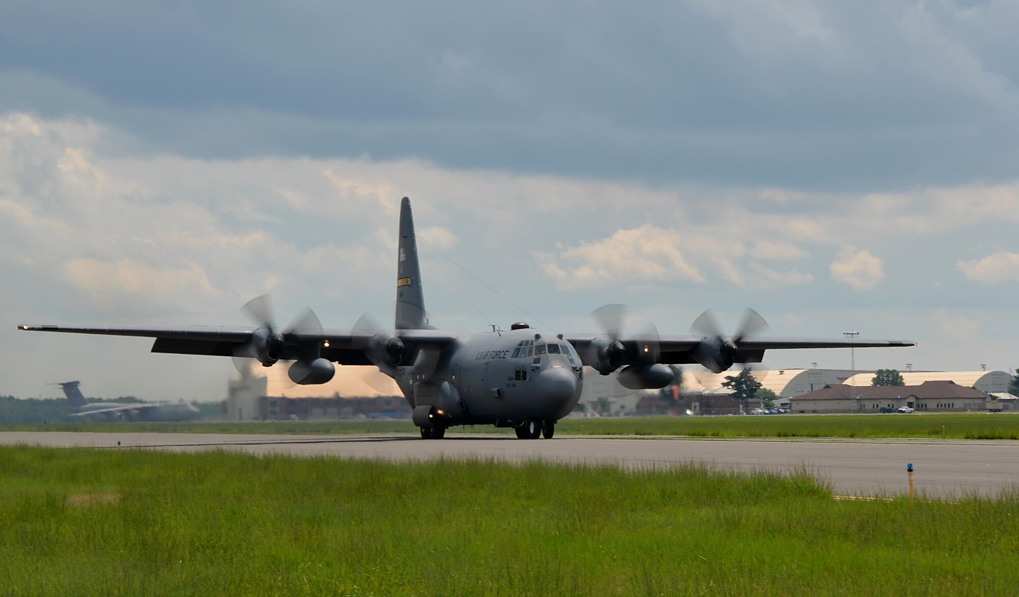 A C-130 Hercules from the 103rd Airlift Wing, East Granby, taxis down the runway to perform a combat-style offload July 11, at the dog patch. 