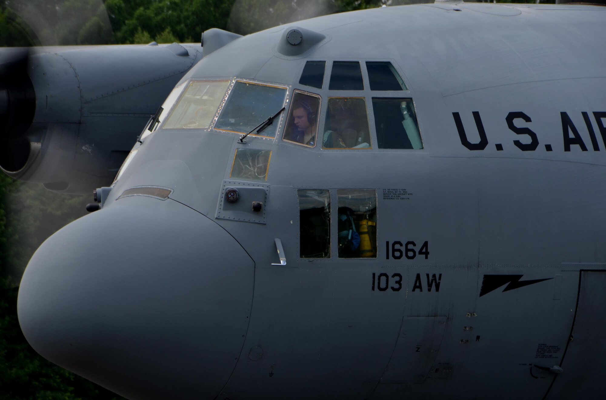 A pilot assigned to the 103rd Airlift Wing, East Granby, Conn., prepares to taxi back to the runway for takeoff July 11, at the Dogpatch. 103rd AW aircrew frequently come to Westover to practice air drops and will begin to practice combat offloads more often.