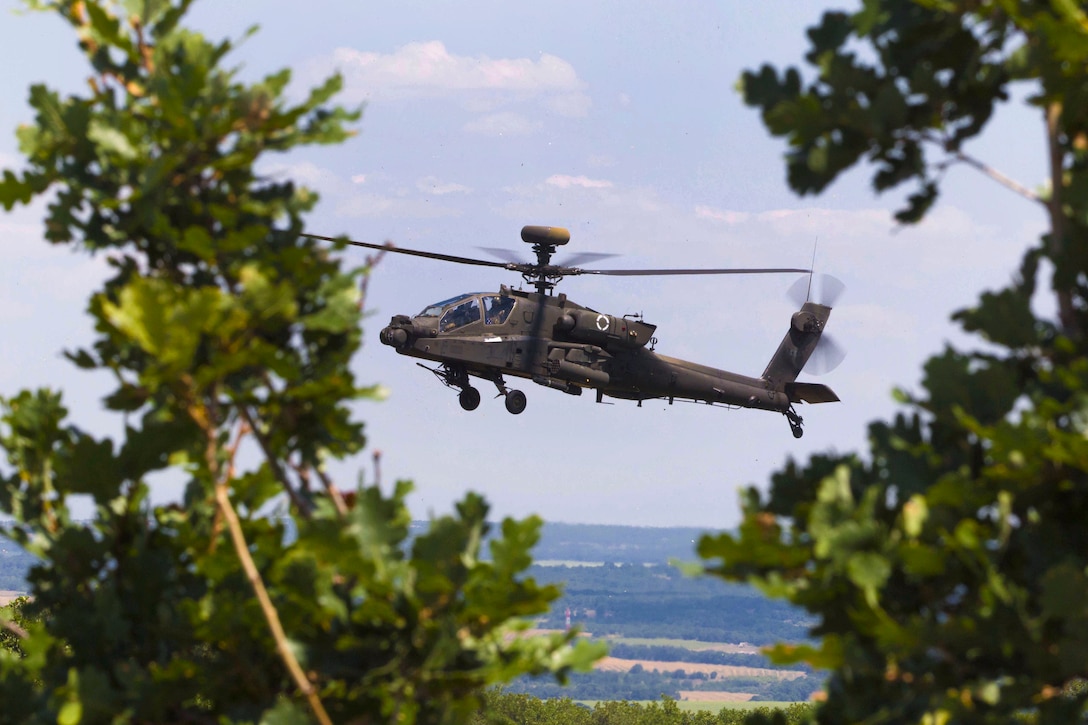 An AH-64 Apache helicopter flies towards an objective during a combined live-fire exercise Peace Sentinel in Koren, Bulgaria, July 19, 2017. The exercise is part of the Saber Guardian 17 exercise.
The pilots are assigned to Company C, 1st Battalion, 501st Attack Reconnaissance Battalion, Task Force Falcon, 10th Combat Aviation Brigade. Saber Guardian 17 is a U.S. European Command, multinational exercise in the Black Sea region that builds readiness and improves interoperability among the 20 allies who participate. Army photo by Spc. Thomas Scaggs