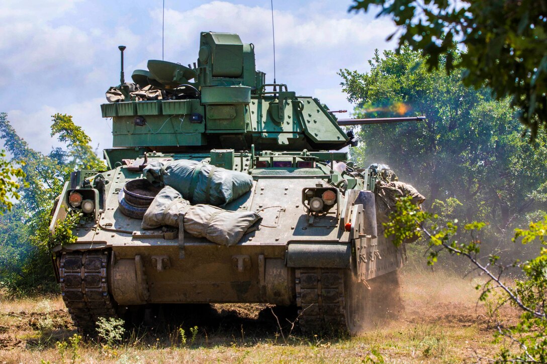 A Bradley fighting vehicle fires on mock opposing forces during combined live-fire exercise Peace Sentinel in Koren, Bulgaria, July 19, 2017. The exercise is part of Saber Guardian 17. Army photo by Spc. Thomas Scaggs