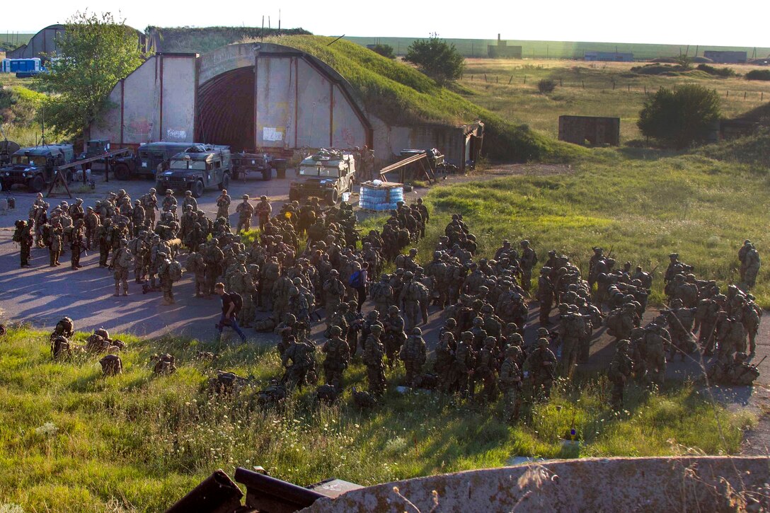 U.S., Greek and Canadian troops await the arrival of UH-60 Black Hawk helicopters before participating in air assault training during the Swift Response exercise at Bezmer Air Base, Bulgaria, July 21, 2017. The exercise is part of Saber Guardian 17. Army photo by Spc. Thomas Scaggs