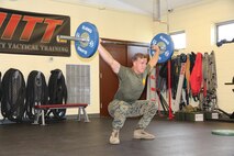 Sgt. Justin Odom, Marine Corps Systems Command training non-commissioned officer, performs a snatch lift July 18, at the High Intensity Tactical Training facility aboard Marine Corps Base Quantico, Virginia. After earning the top male competitor spot in the HITT preliminaries at Quantico, Odom was selected to represent the base in the Third Annual HITT Athlete Championship at Camp Pendleton, California, in August. (U.S. Marine Corps photo by Kaitlin Kelly)