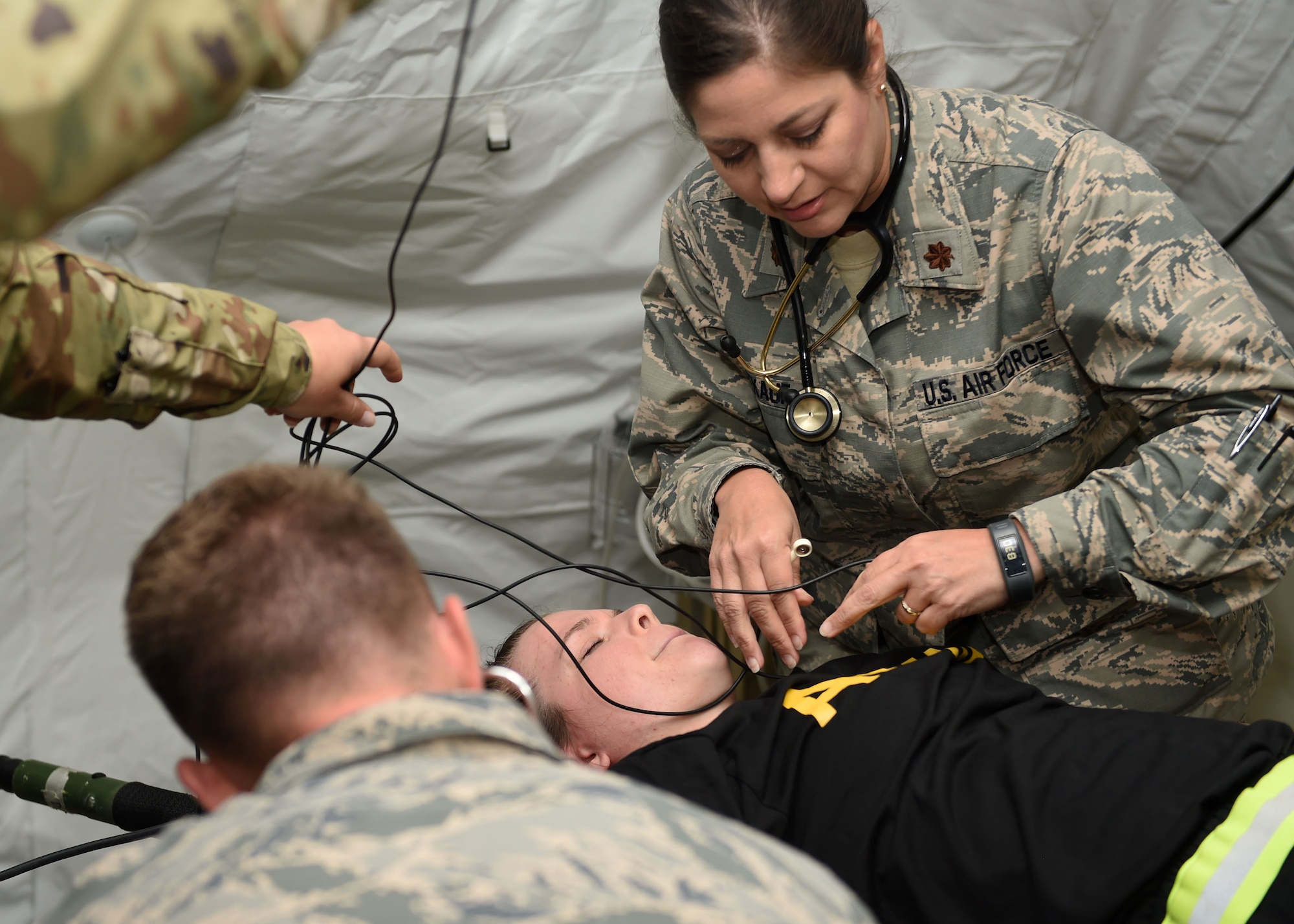 Maj. Tonja Winekauf, a nurse practioner, attends to a patient during a joint training exercise July 24, 2017, at Camp Dodge in Johnston, Iowa. Medics from the Iowa Air and Army National Guard as well as Kosovo and the United Kingdom gathered for the two-week exercise. (U.S. Air National Guard photo by Staff Sgt. Michael J. Kelly)
