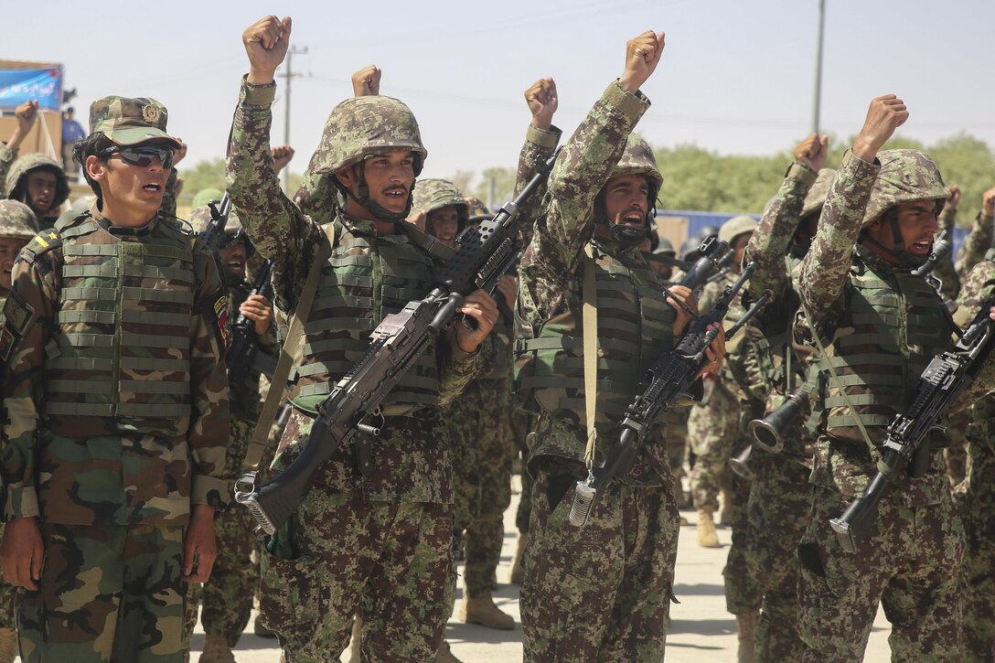 Afghan National Army soldiers with 2nd Kandak, 4th Brigade, 215th Corps chant their unit’s battle song during a graduation ceremony at Camp Shorabak, Afghanistan, July 24, 2017. Hundreds of soldiers completed an operational readiness cycle at the Helmand Province Regional Military Training Center, an eight-week course designed to enhance its students’ infantry and warfighting capabilities. (U.S. Marine Corps photo by Sgt. Lucas Hopkins)