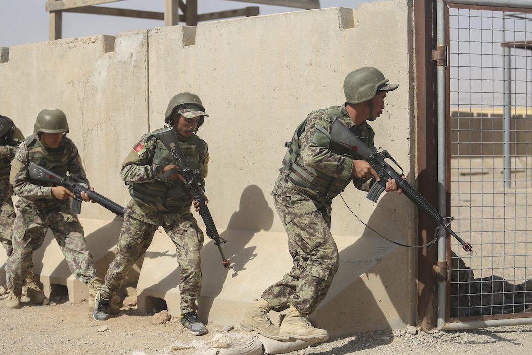 Afghan National Army soldiers with 2nd Kandak, 4th Brigade, 215th Corps conduct military operations in urban terrain training at Camp Shorabak, Afghanistan, July 7, 2017. The unit completed an eight-week operational readiness cycle at the Helmand Province Regional Military Training Center July 24 with assistance from U.S. Marine advisors assigned to Task Force Southwest. Throughout the course, approximately 600 soldiers enhanced their infantry and weapons skills in order to promote security and stability in the region. (U.S. Marine Corps photo by Sgt. Lucas Hopkins)