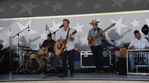 United States Air Force band, Wild Blue Country, performs at the annual Summer Slam base picnic at Schriever Air Force Base, Colorado, Friday, July 21, 2017. Airmen who participated in the picnic were able to enjoy fun and games, food and goodies while listening to the band live. (U.S. Air Force photo/ Airman 1st Class William Tracy)