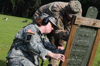 U.S. Army Reserve Staff Sgt. Lisa Rodriguez-Presley examines her target during weapons qualification July 22, 2017. Weapons qualifiication is a yearly event for the reserve soldiers and is part of the Fight Tonight Initiative to improve soldier readiness.