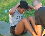 U.S. Army Reserve Spc. Chelsea Fleetwood completes  her 52nd sit-up during her APFT july 21, 2017, Ft. Gordon, Ga. Fleetwood trains hard to surpass the Army standard of fitness and supports the Fight Tonight Initiative.