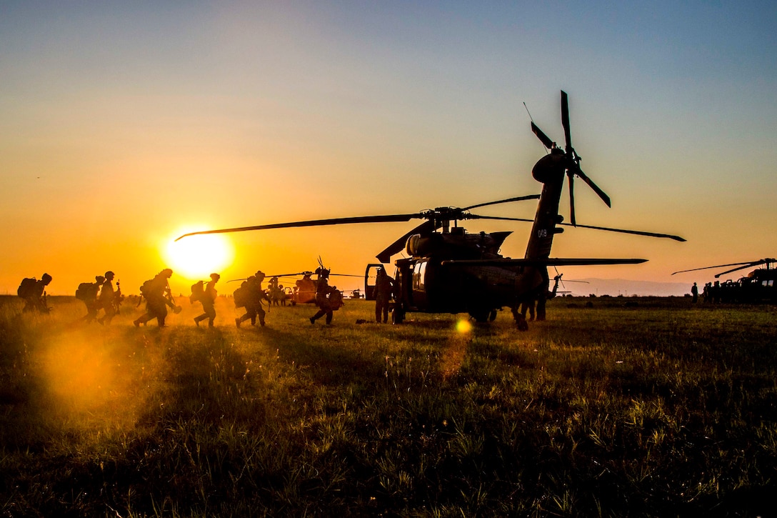 U.S. soldiers board an UH-60 Black Hawk helicopter before participating in night air assault training during exercise Swift Response at Bezmer Air Base, Bulgaria, July 21, 2017. The exercise is part of Saber Guardian 17. Army photo by Spc. Thomas Scaggs