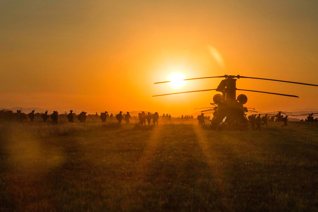 U.S. soldiers practice board an UH-60 Black Hawk helicopter before participating in night air assault training during exercise Swift Response at Bezmer Air Base, Bulgaria, July 21, 2017. The exercise is part of Saber Guardian 17. Army photo by Spc. Thomas Scaggs