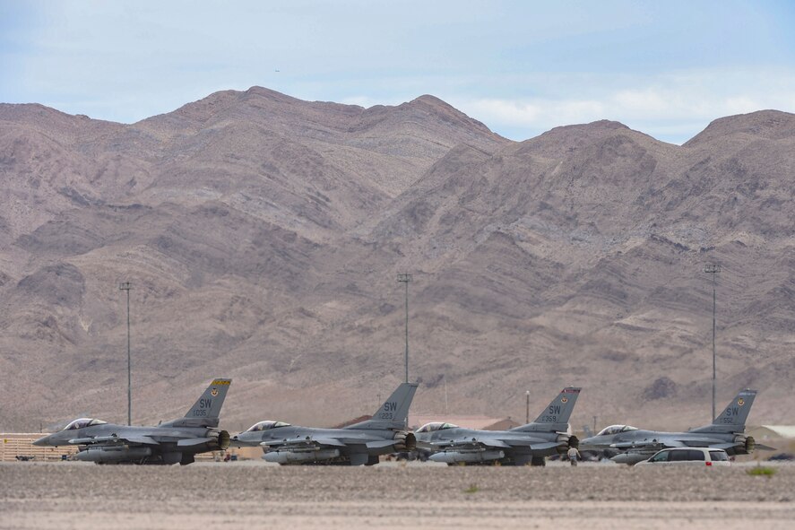 A flight of four F-16 Fighting Falcons from the 55th Fighter Squadron, Shaw Air Force Base, S.C., perform their pre-flight checks before taking off from Nellis Air Force Base, Nev., to participate in Red Flag 17-3 July 24, 2017. The F-16 is a highly maneuverable, multi-role fighter aircraft. (U.S. Air Force photo by Airman 1st Class Andrew D. Sarver/Released)