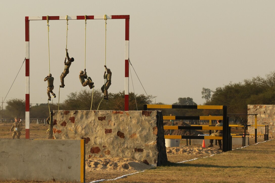 Jamaican competitors ascend ropes during an obstacle course for Fuerzas Comando on July 24, 2017, in Vista Alegre, Paraguay. Nations competing in Fuerzas Comando refine the tactics used by their special operations forces. By increasing their special operations capabilities, countries become more proficient at confronting common threats. (U.S. Army photo by Sgt. Joanna Bradshaw/Released)