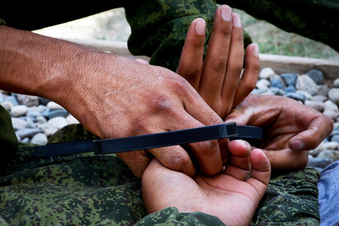 A Tajik service member participates in a field training exercise that's part of the multinational exercise Regional Cooperation 2017 in Fakhrabad, Tajikistan, July 17, 2017. Air Force photo by Staff Sgt. Michael Battles