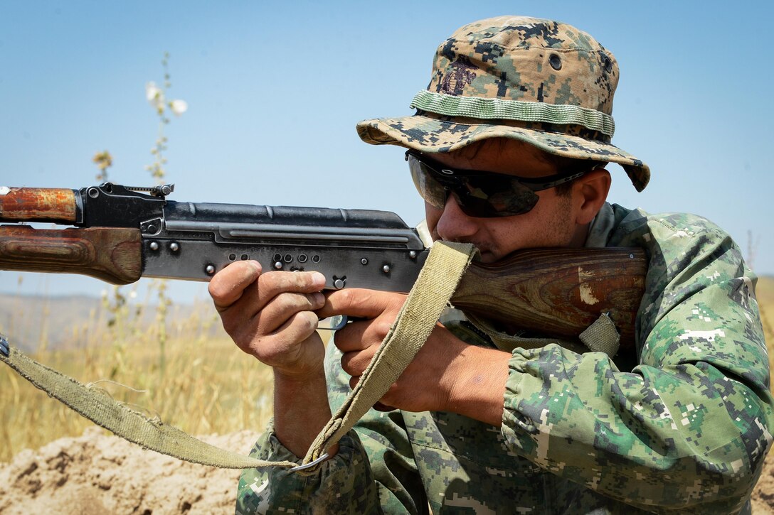 A Tajik service members assumes a defensive firing position during a field training exercise that's part of multinational exercise Regional Cooperation 2017 in Fakhrabad, Tajikistan, July 17, 2017. Hosted by Tajikistan's Ministry of Defense, RC 17 affords participants the opportunity to exercise a United Nations directive to practice counterterrorism, border security and peacekeeping operations. Air Force photo by Staff Sgt. Michael Battles